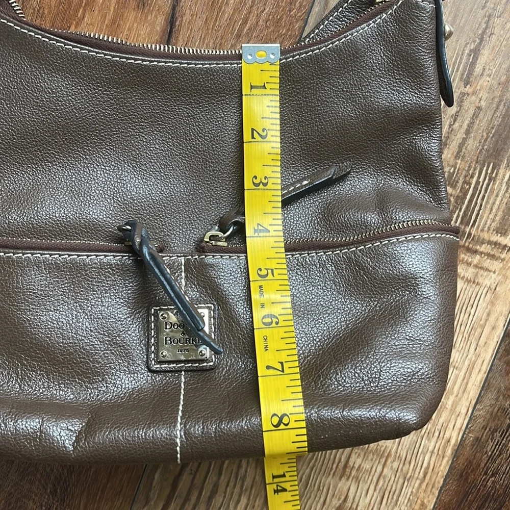 Dooney and Bourke. Brown leather shoulder bag. Has interior stains. - Picture 13 of 14